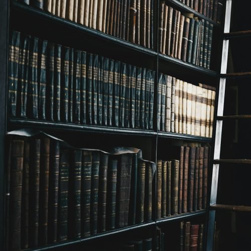 Photo by Giammarco Boscaro black wooden d and c bookshelf